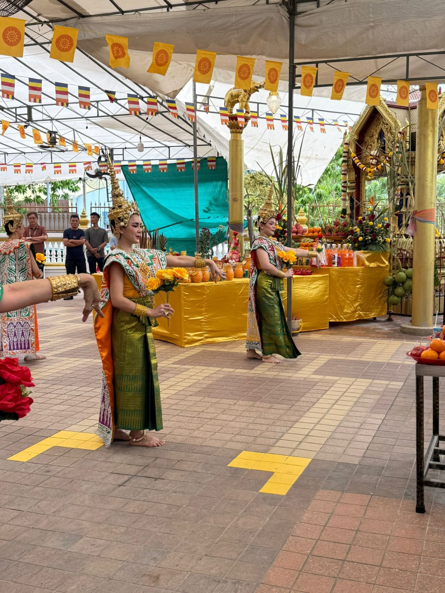 Traditional dancers performing during the Phra Phrom celebration